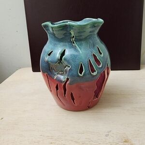 The Lufkin Pottery Witness Crock is a beautifully crafted art pottery candle hol